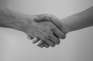 Black and white photo of a handshake