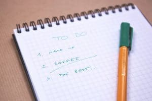 Close up photo of pen and notepad with to-do list